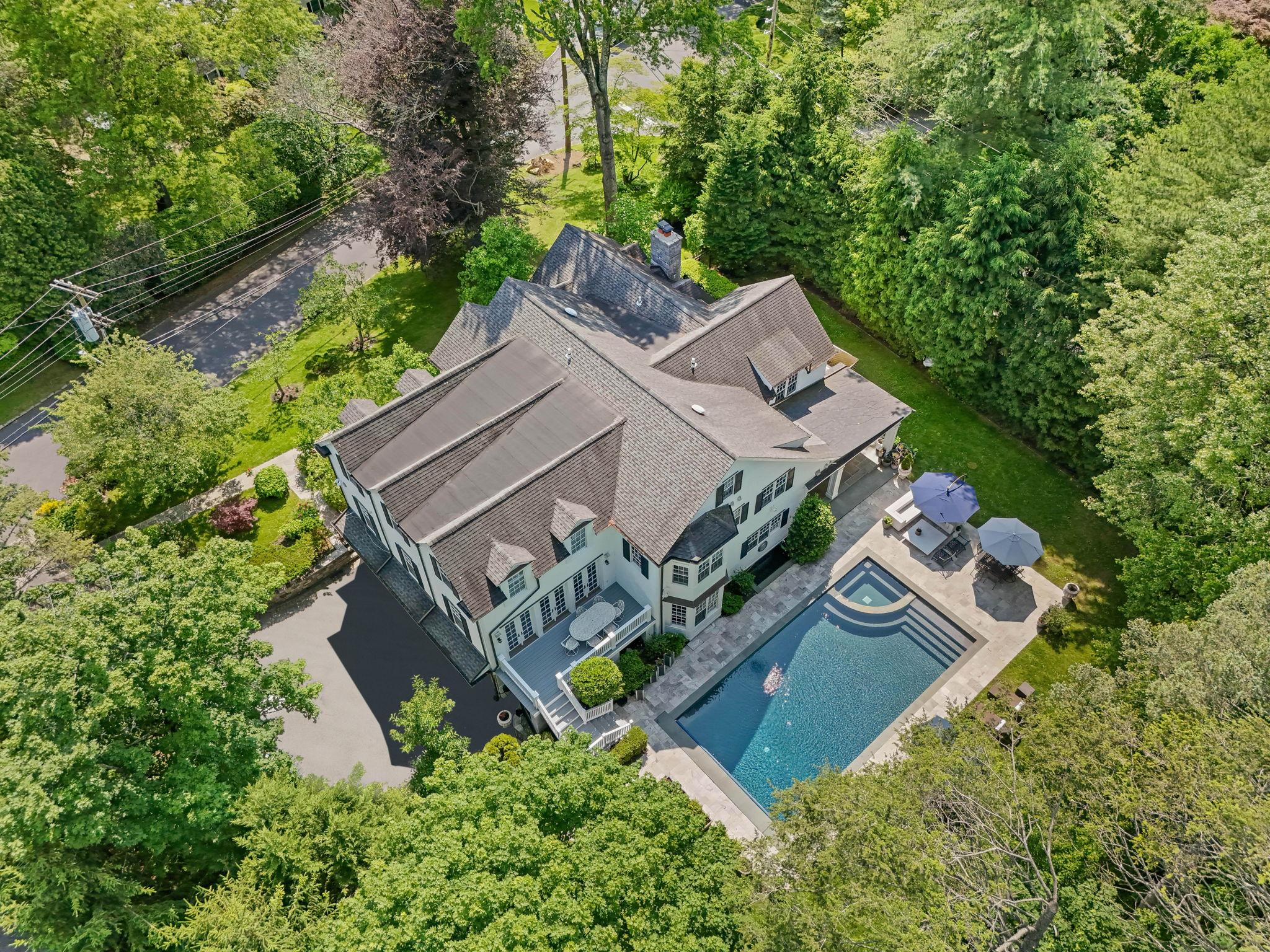 an aerial view of a house with a garden