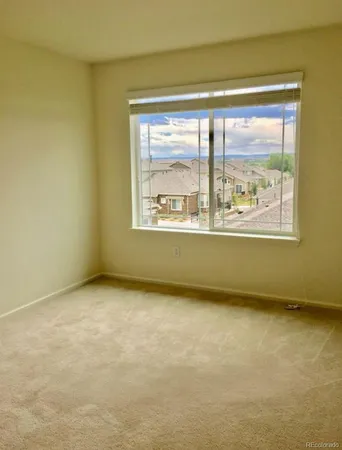 a view of a room that has a window
