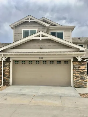 a view of a house with a garage