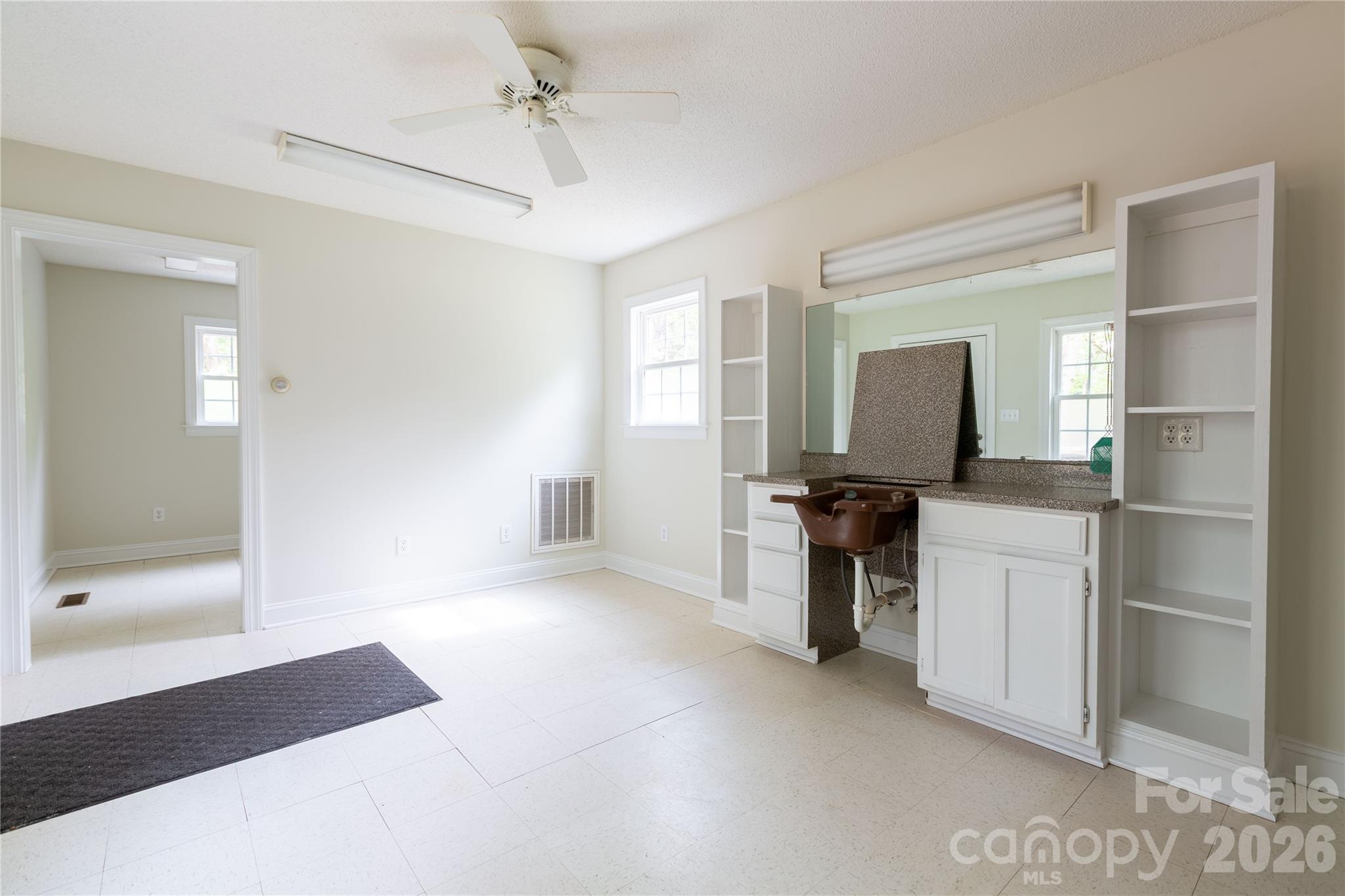 1224 Loop Road Hookerton, NC 28538 - Photo 24 of 47 a kitchen with a refrigerator and a stove top oven