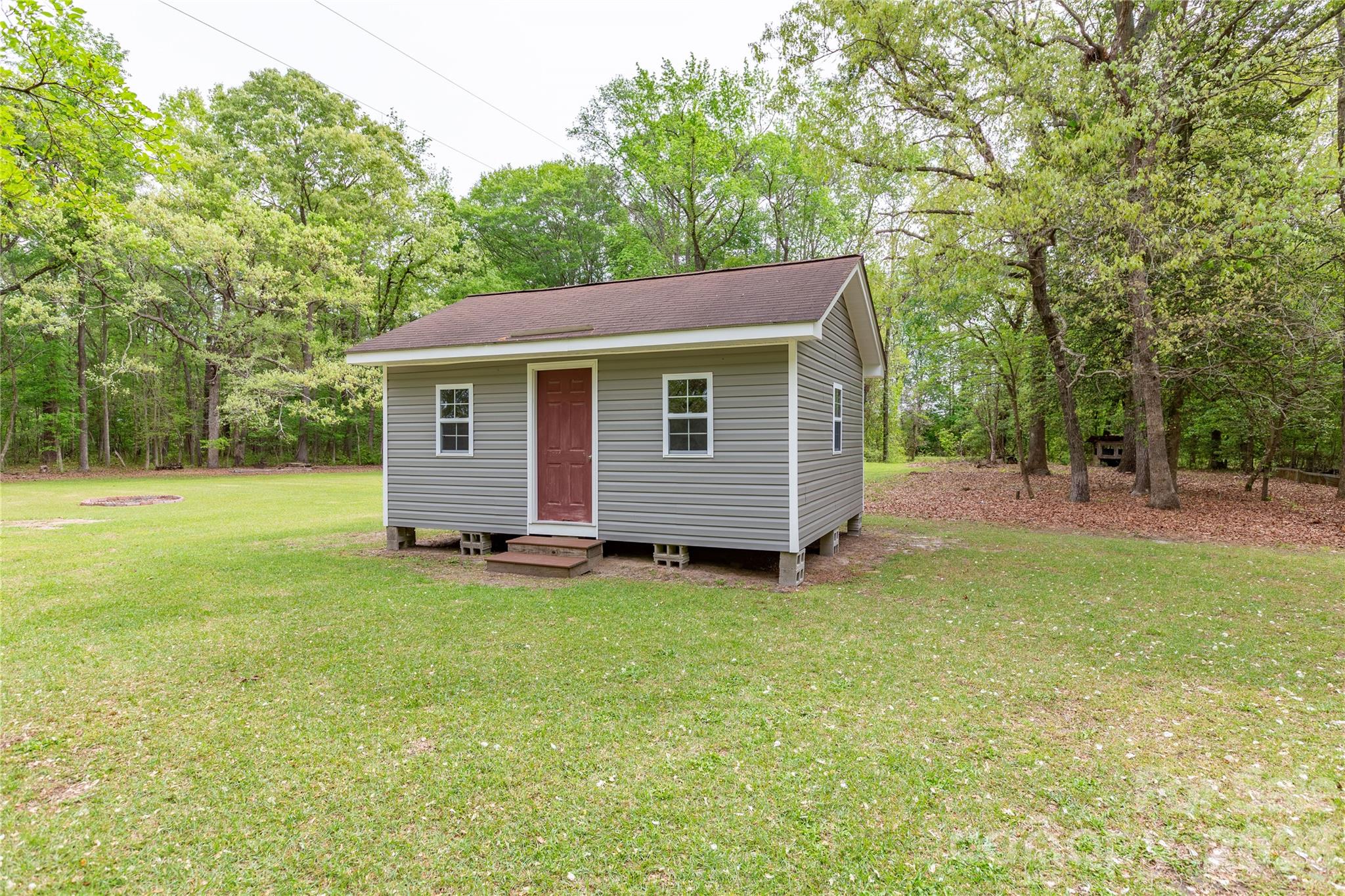 1224 Loop Road Hookerton, NC 28538 - Photo 27 of 47 a view of a backyard with a garden
