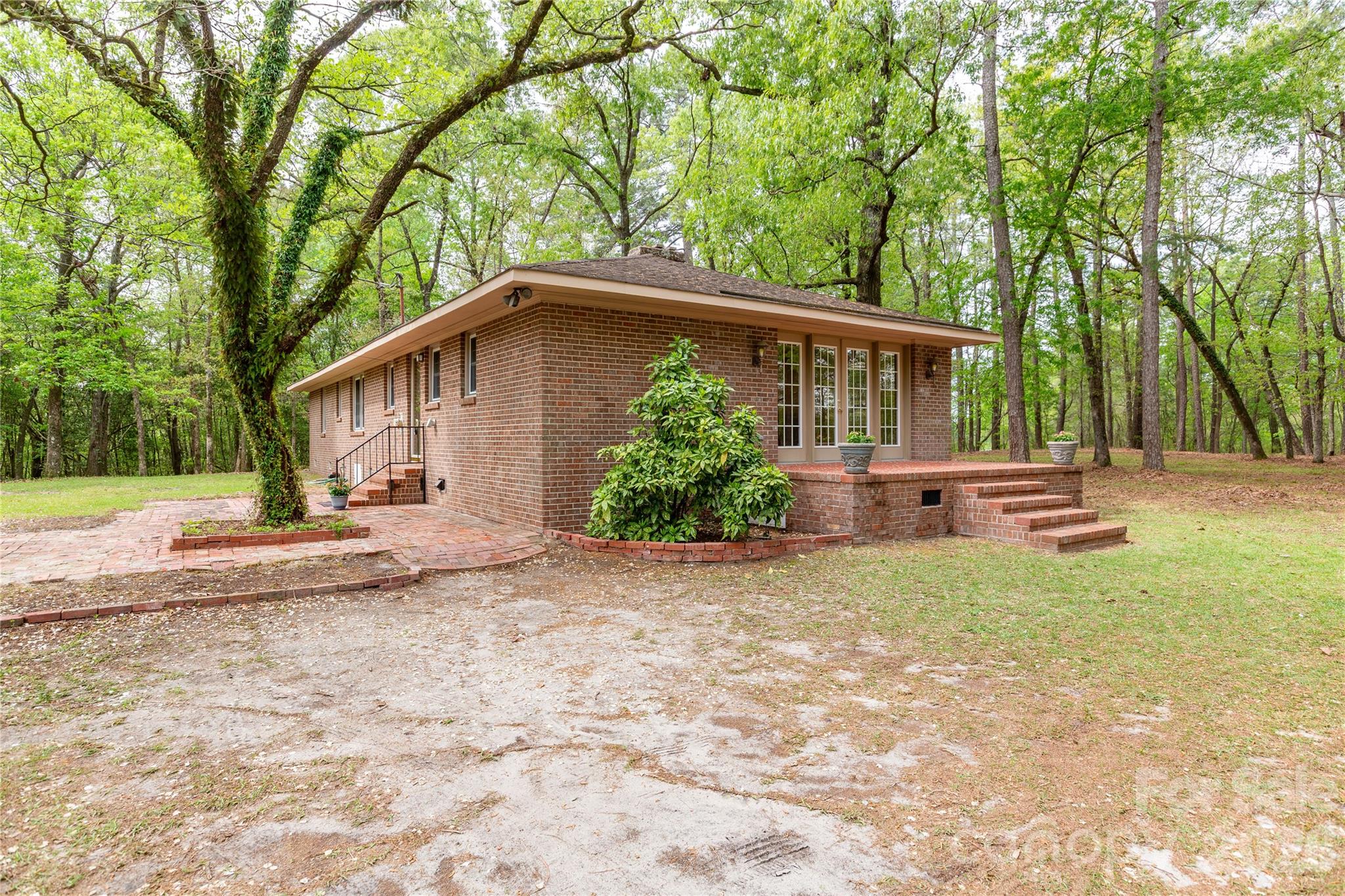1224 Loop Road Hookerton, NC 28538 - Photo 34 of 47 a front view of a house with garden
