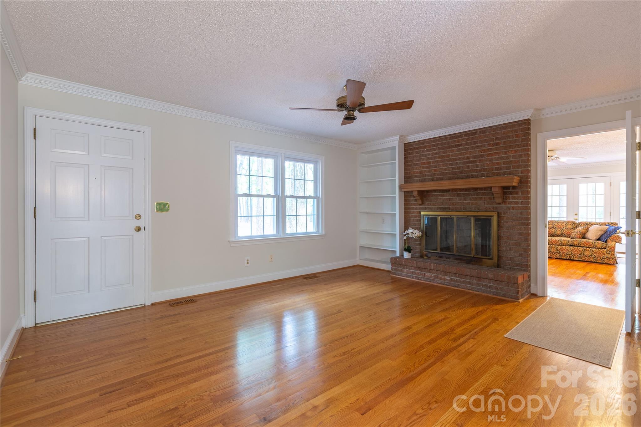 1224 Loop Road Hookerton, NC 28538 - Photo 7 of 47 a view of empty room with wooden floor and fireplace