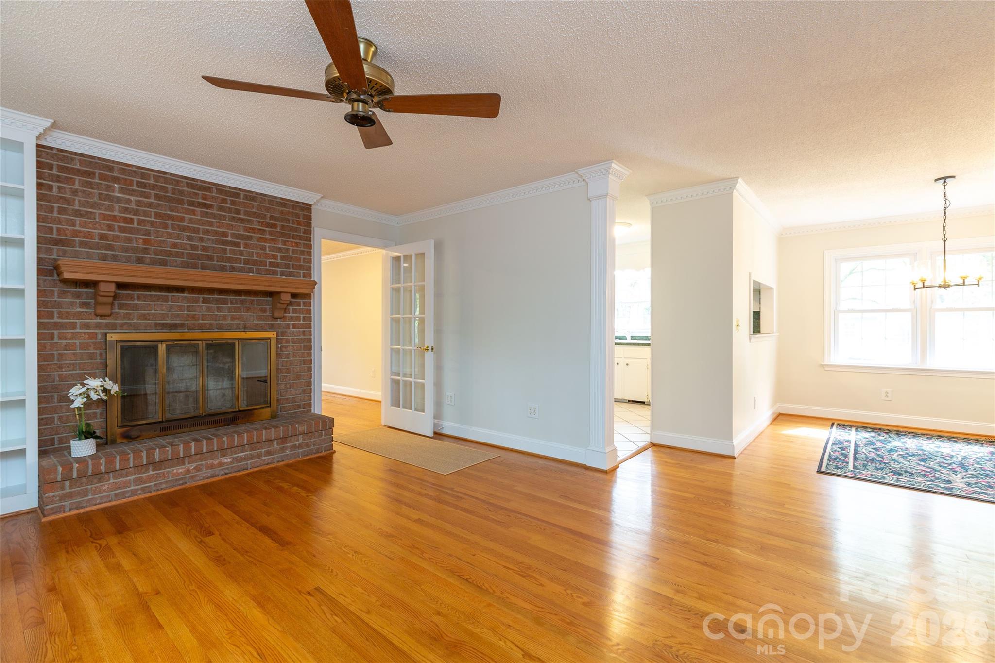 1224 Loop Road Hookerton, NC 28538 - Photo 8 of 47 a view of a livingroom with wooden floor a fireplace and window