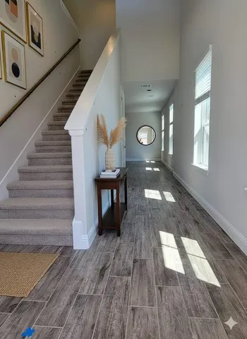 a view of entryway with wooden floor