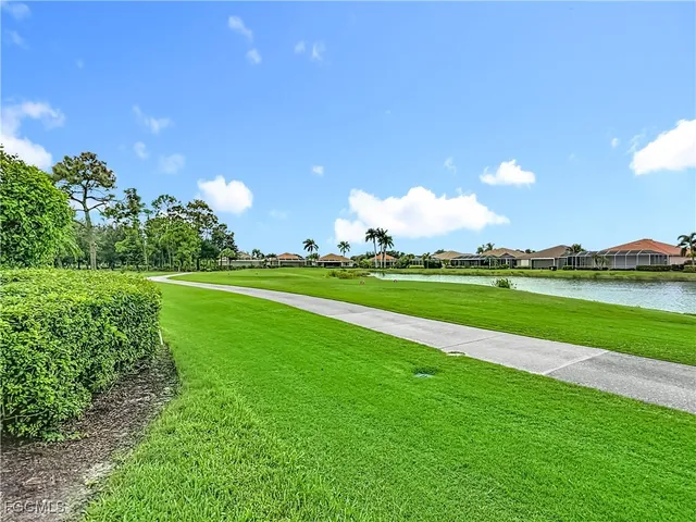 a view of a golf course with a lake