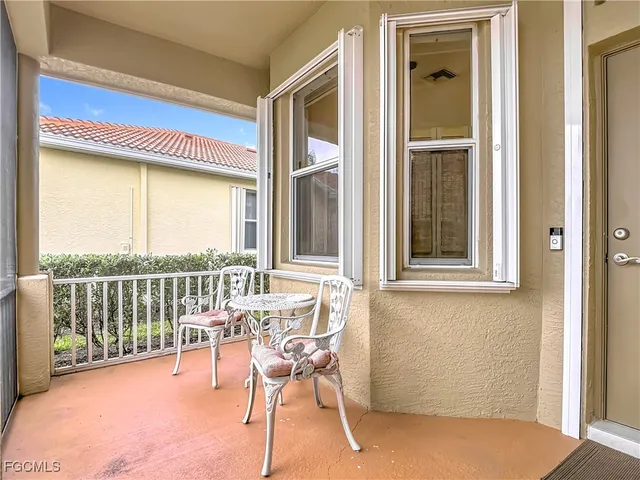 a view of a balcony with chairs