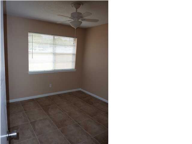 537 Hickory Avenue, Unit B Niceville, FL 32578 - Photo 11 of 19 a view of an empty room with a window