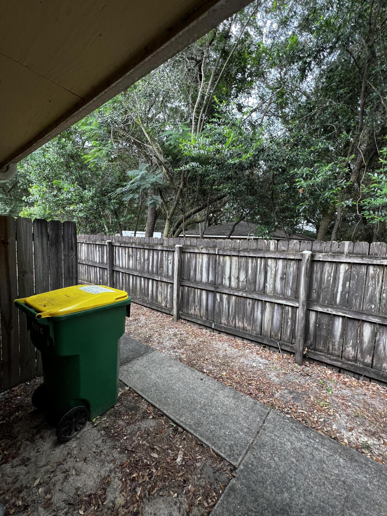 537 Hickory Avenue, Unit B Niceville, FL 32578 - Photo 13 of 19 a view of a backyard with a small cabin