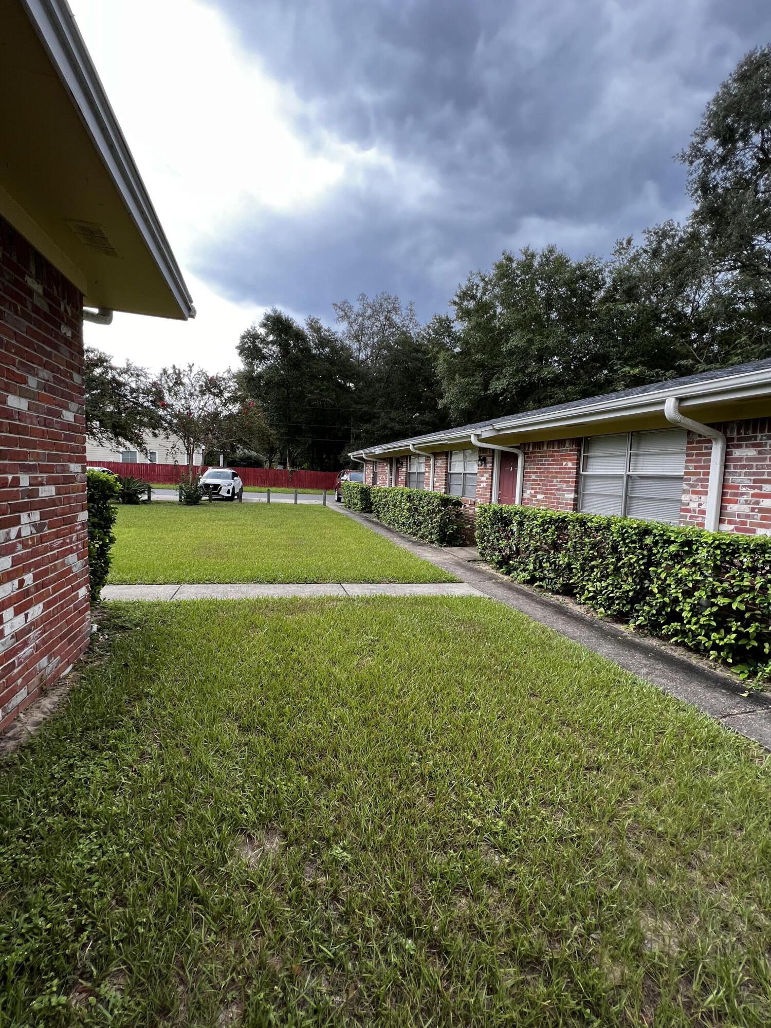 537 Hickory Avenue, Unit B Niceville, FL 32578 - Photo 17 of 19 a view of a house with a yard