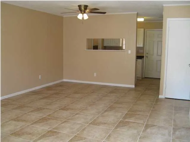 a view of an empty room with a bathroom