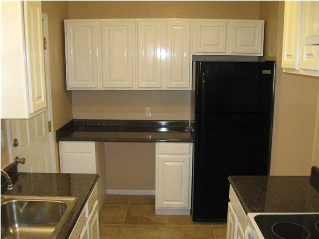 537 Hickory Avenue, Unit B Niceville, FL 32578 - Photo 7 of 19 a kitchen with a sink and cabinets