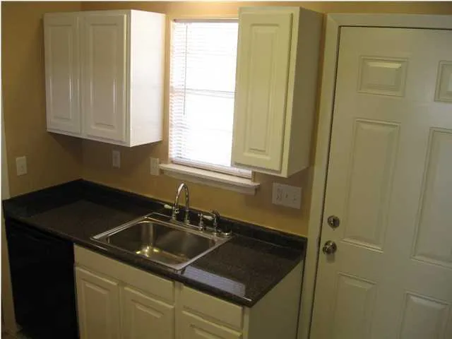 a kitchen that has a sink and a window