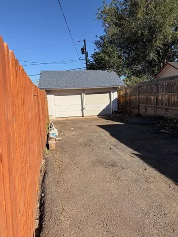 a view of a backyard of the house