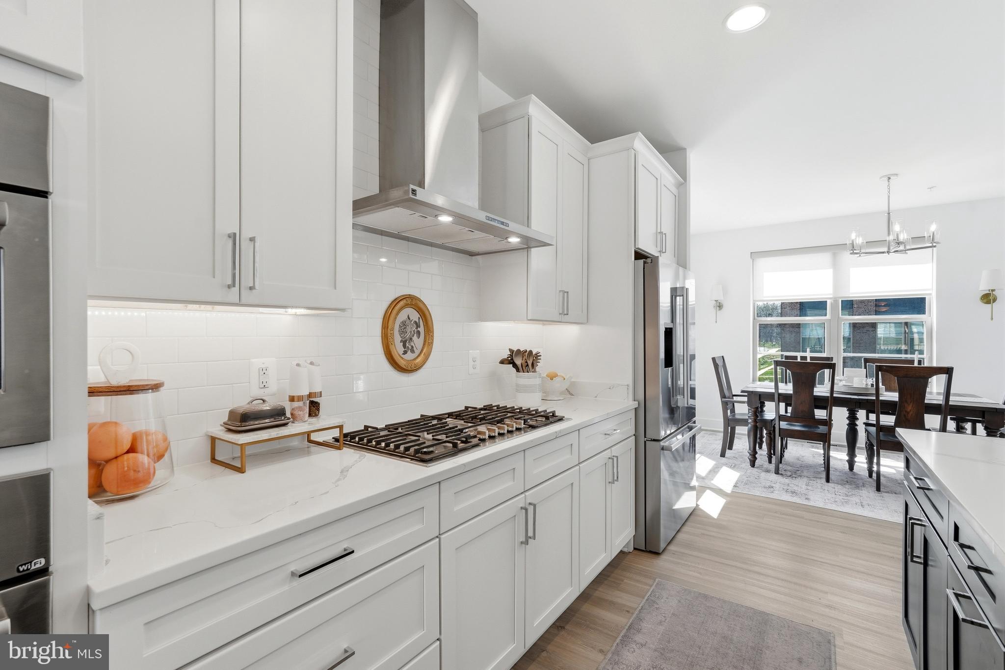 3311 Streamlet Lane Laurel, MD 20724 - Photo 11 of 46 a kitchen with stainless steel appliances granite countertop a stove and a refrigerator