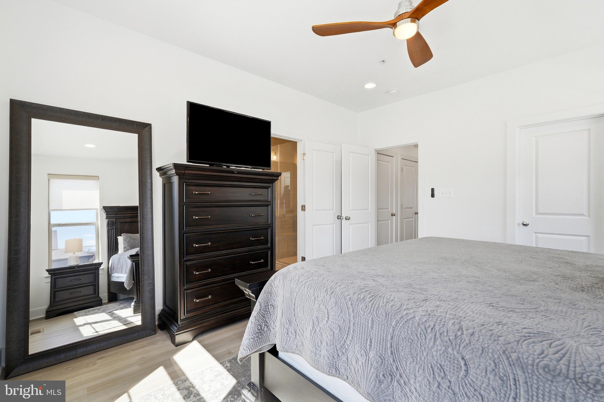 3311 Streamlet Lane Laurel, MD 20724 - Photo 30 of 46 a bedroom with a bed and a flat screen tv