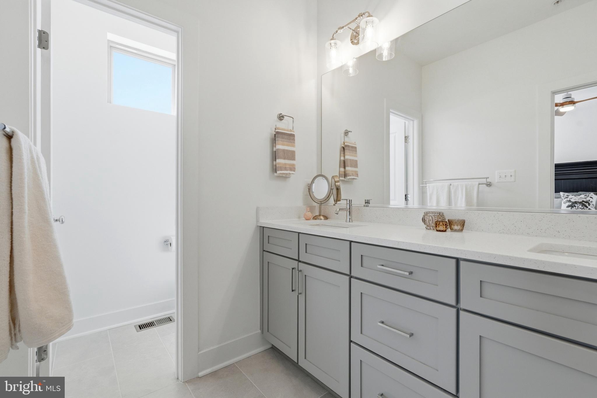 3311 Streamlet Lane Laurel, MD 20724 - Photo 32 of 46 a bathroom with a sink and a mirror