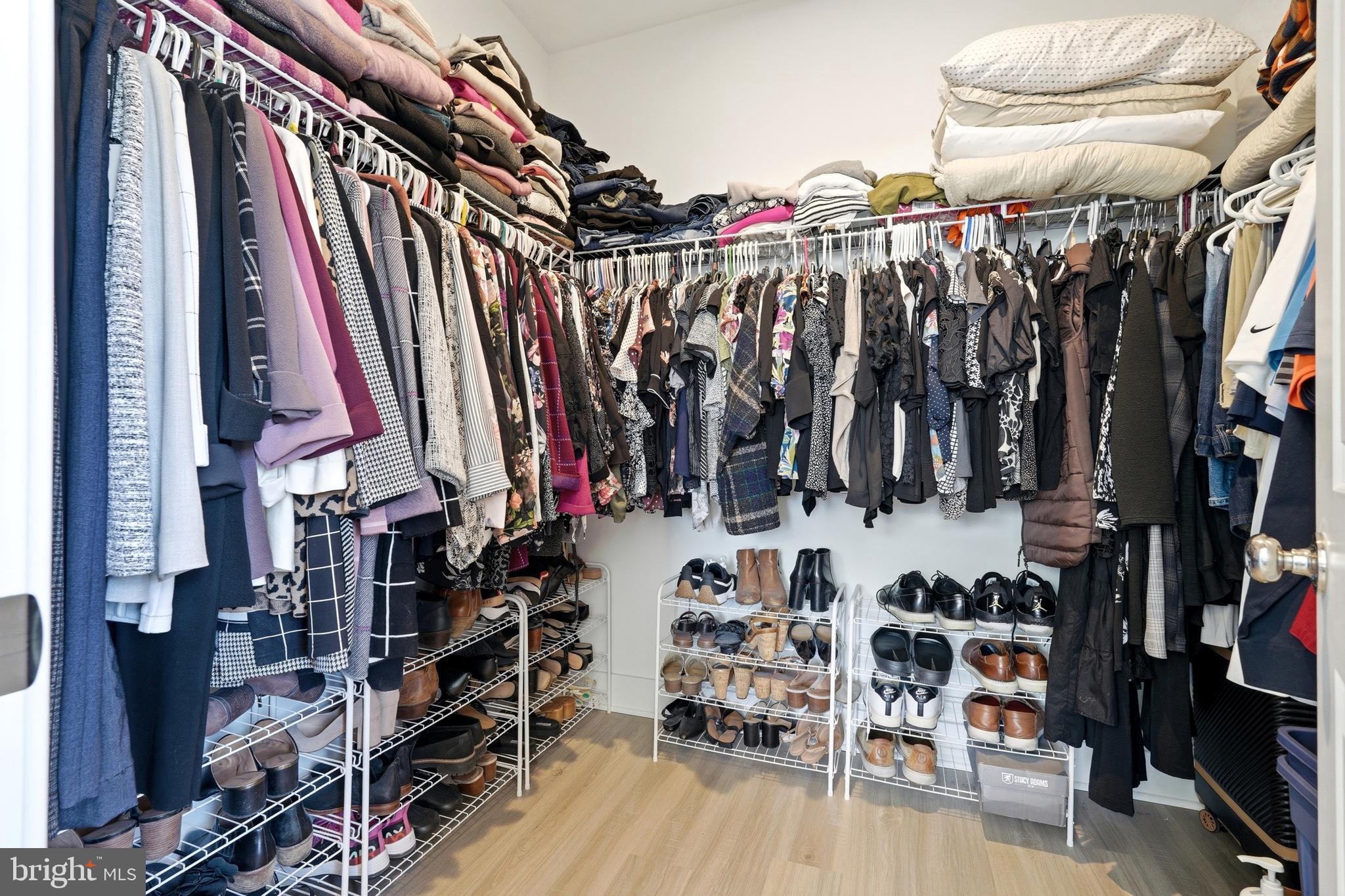 3311 Streamlet Lane Laurel, MD 20724 - Photo 33 of 46 a view of walk in closet with clothes and shoes
