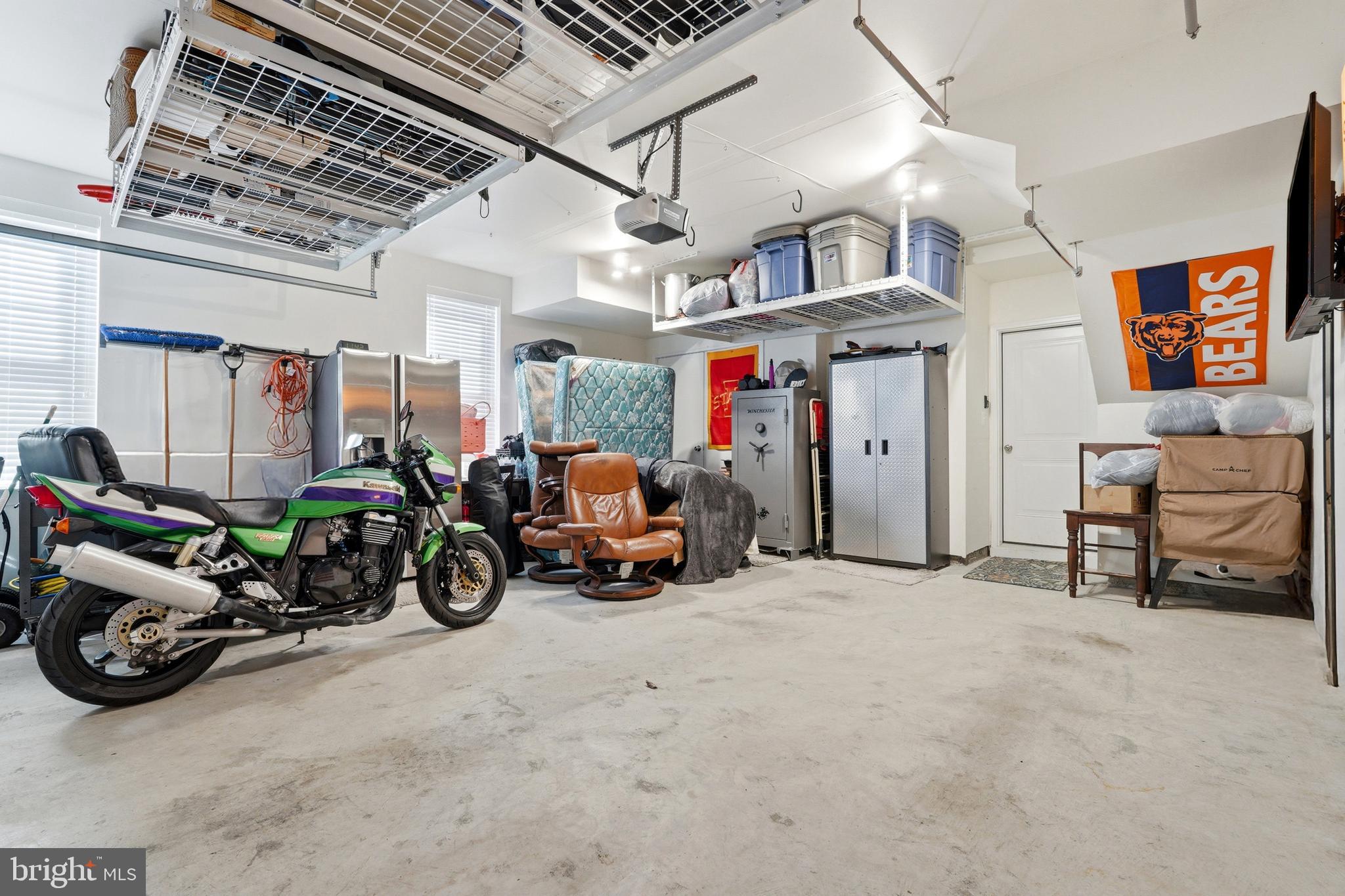 3311 Streamlet Lane Laurel, MD 20724 - Photo 41 of 46 a view of a garage with a bike and a car