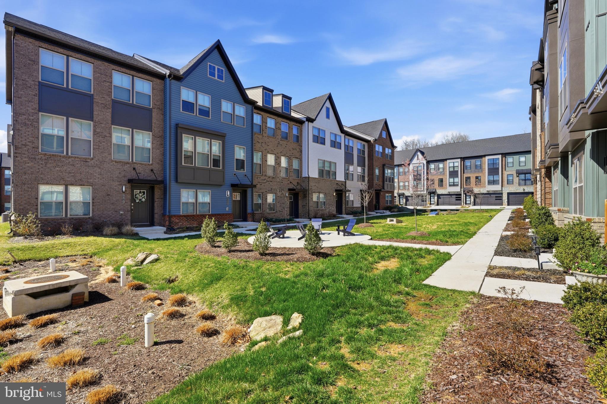 3311 Streamlet Lane Laurel, MD 20724 - Photo 46 of 46 a front view of a building with a garden and plants