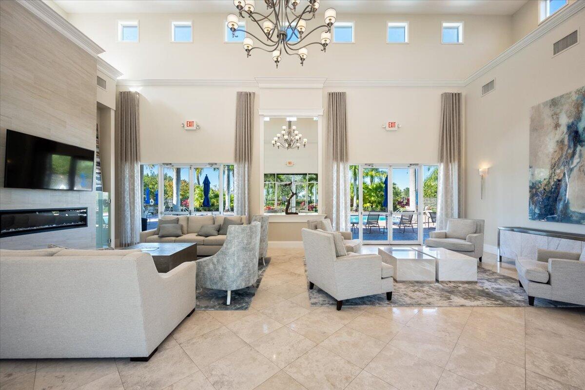 1238 Bay View Way Wellington, FL 33414 - Photo 37 of 39 a living room with furniture and a flat screen tv