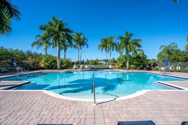 a view of a swimming pool and lounge chair