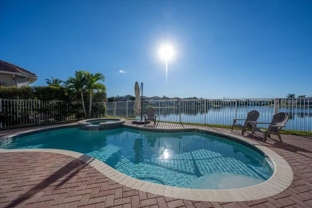 a view of a swimming pool with a lounge chair