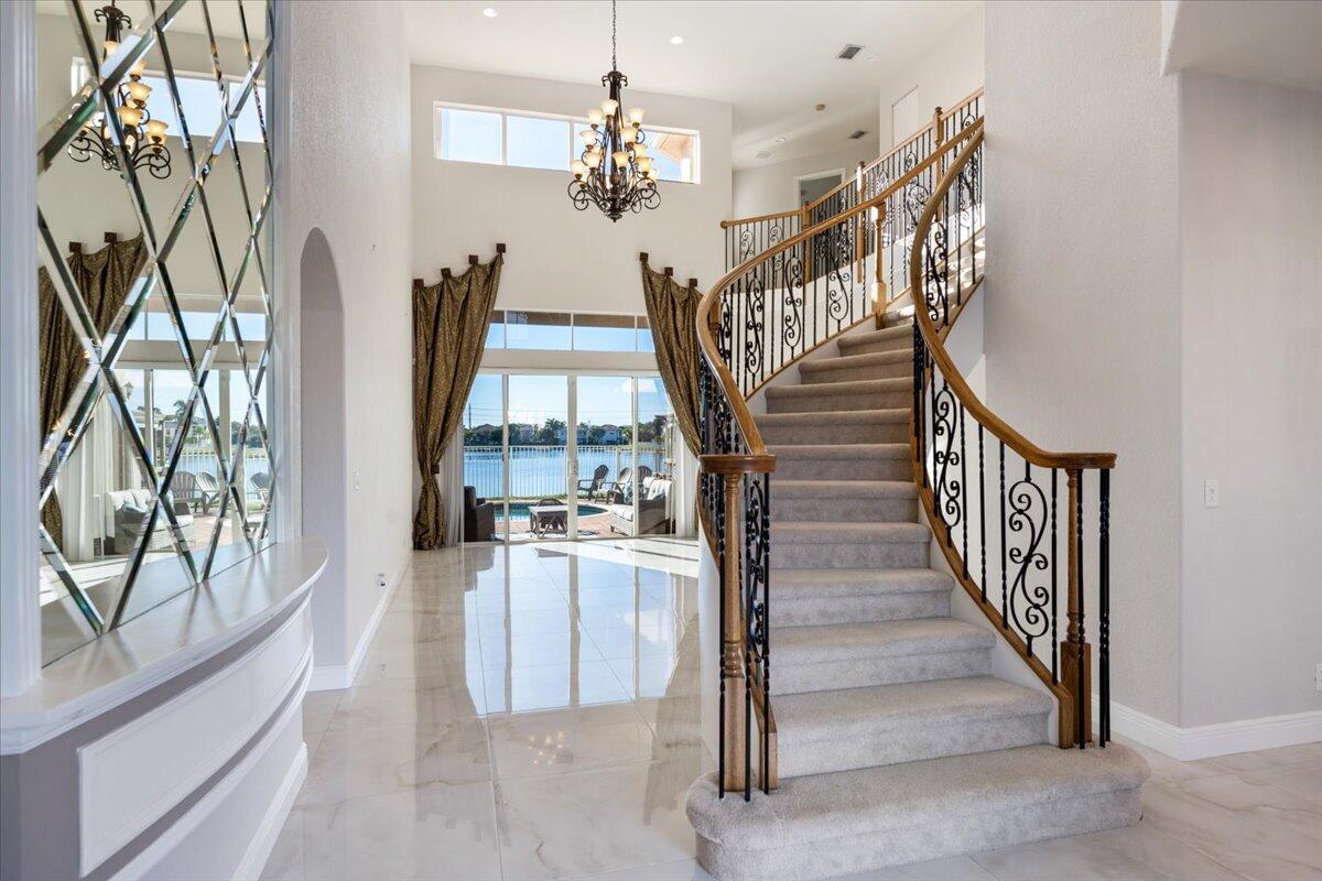 1238 Bay View Way Wellington, FL 33414 - Photo 6 of 39 a view of a livingroom with furniture staircase and front door
