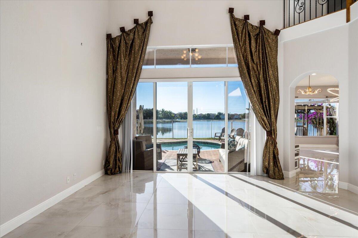1238 Bay View Way Wellington, FL 33414 - Photo 8 of 39 a view of a living room with a floor to ceiling window and storage