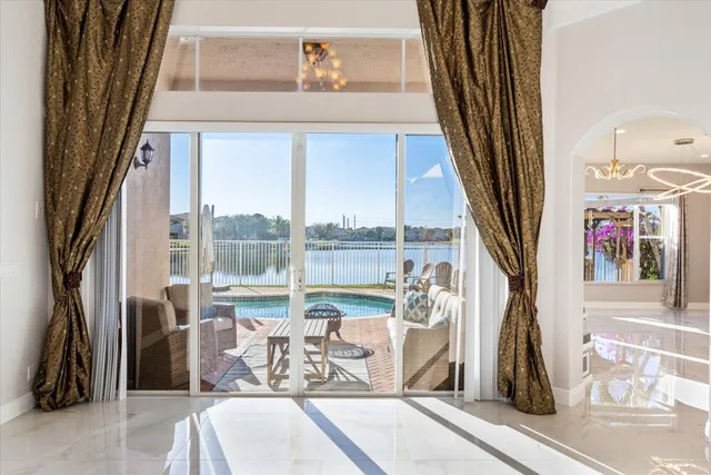 a view of a living room with a floor to ceiling window