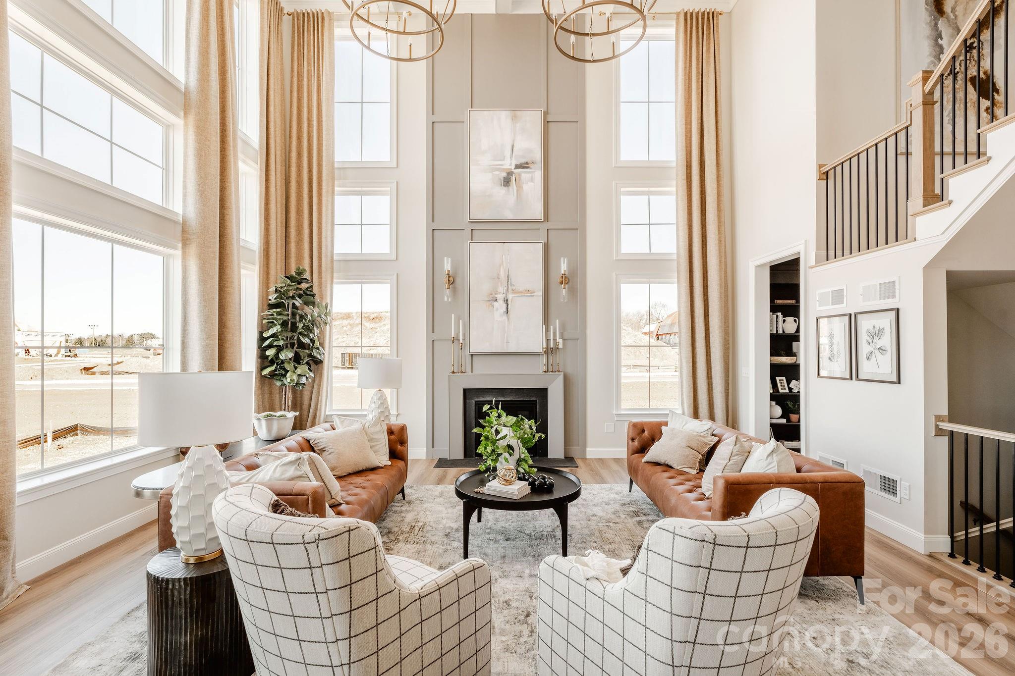 200 Ervin Road, Unit DEVONSHIRE Mooresville, NC 28117 - Photo 21 of 46 a living room with furniture fireplace and large windows