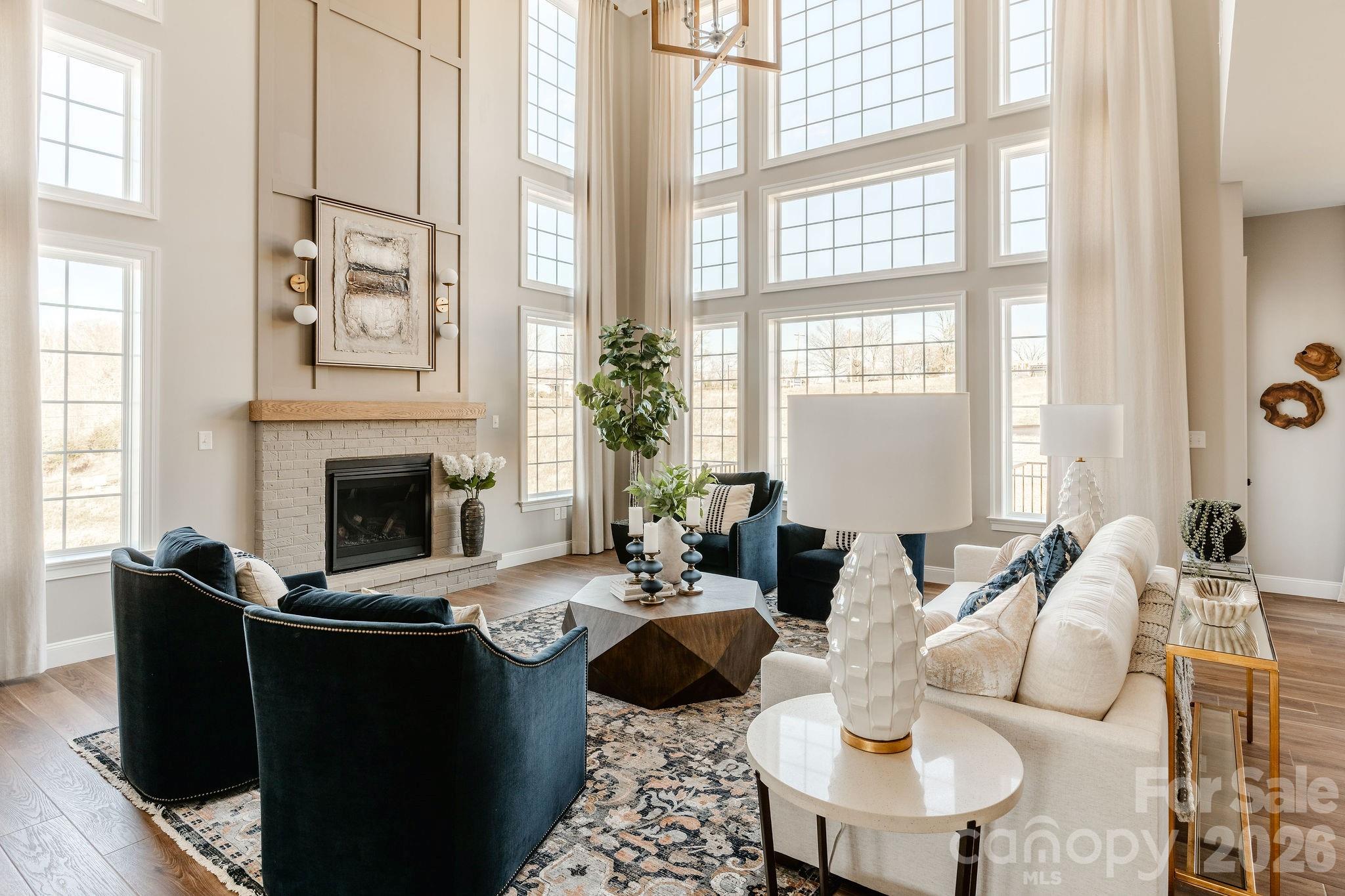 200 Ervin Road, Unit DEVONSHIRE Mooresville, NC 28117 - Photo 22 of 46 a living room with furniture fireplace and a large window