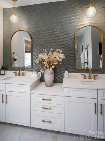 a bathroom with a sink mirror and
