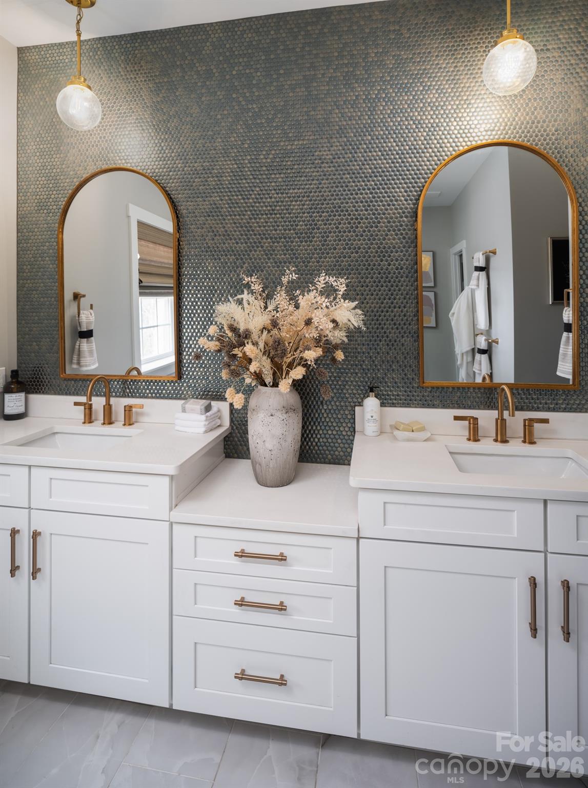 200 Ervin Road, Unit DEVONSHIRE Mooresville, NC 28117 - Photo 34 of 46 a bathroom with a sink mirror and