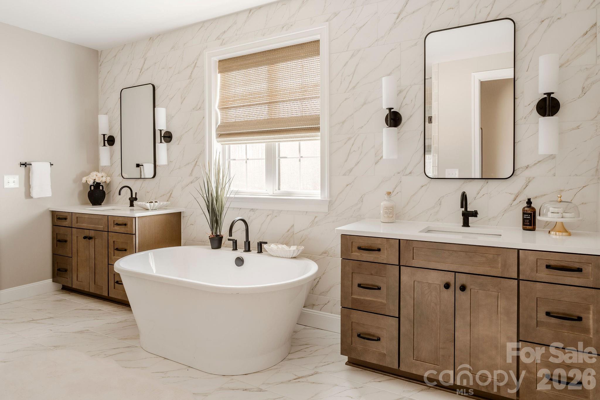 200 Ervin Road, Unit DEVONSHIRE Mooresville, NC 28117 - Photo 38 of 46 a bathroom with a double vanity sink mirror and bathtub