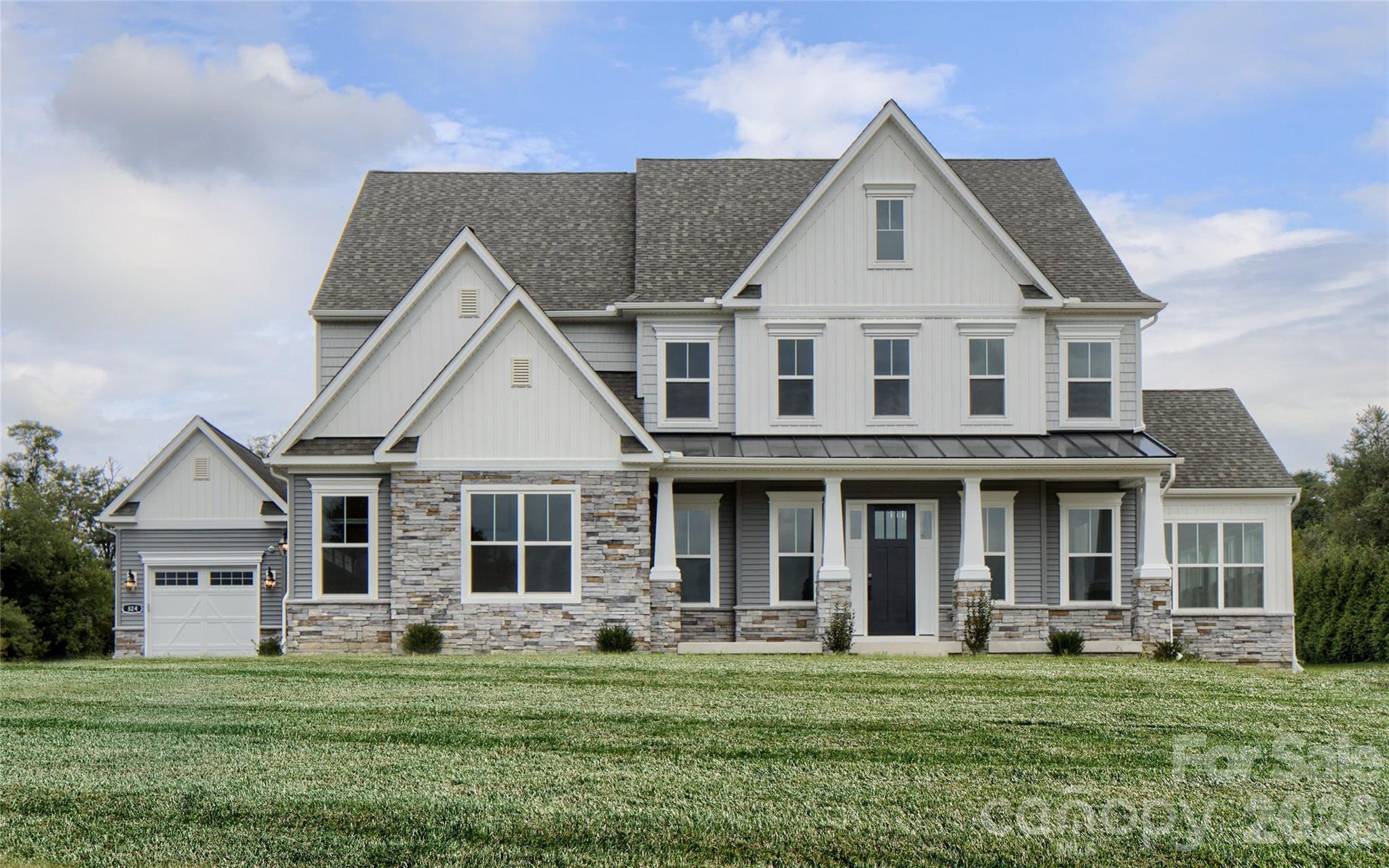 200 Ervin Road, Unit DEVONSHIRE Mooresville, NC 28117 - Photo 10 of 46 a front view of a house with a garden