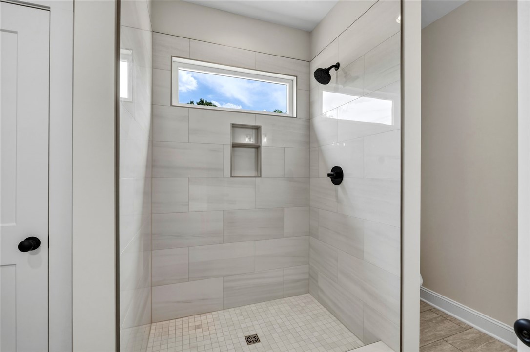 1735 Maw Bridge Road Central, SC 29630 - Photo 20 of 38 This modern shower offers clean lines and abundant natural light for a refreshing experience.