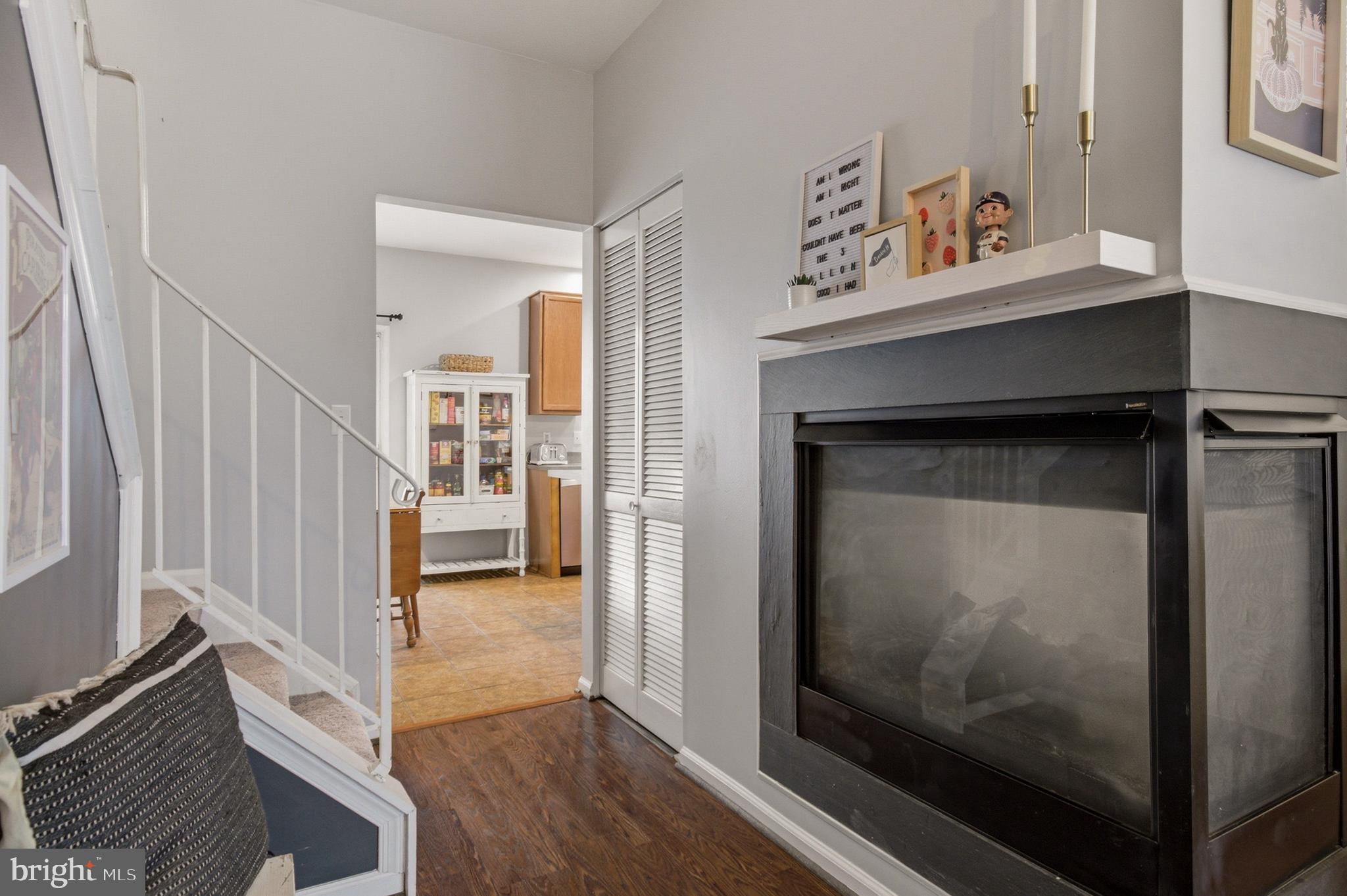 1212 Needham Court Crofton, MD 21114 - Photo 18 of 47 a view of a hallway with wooden floor and staircase