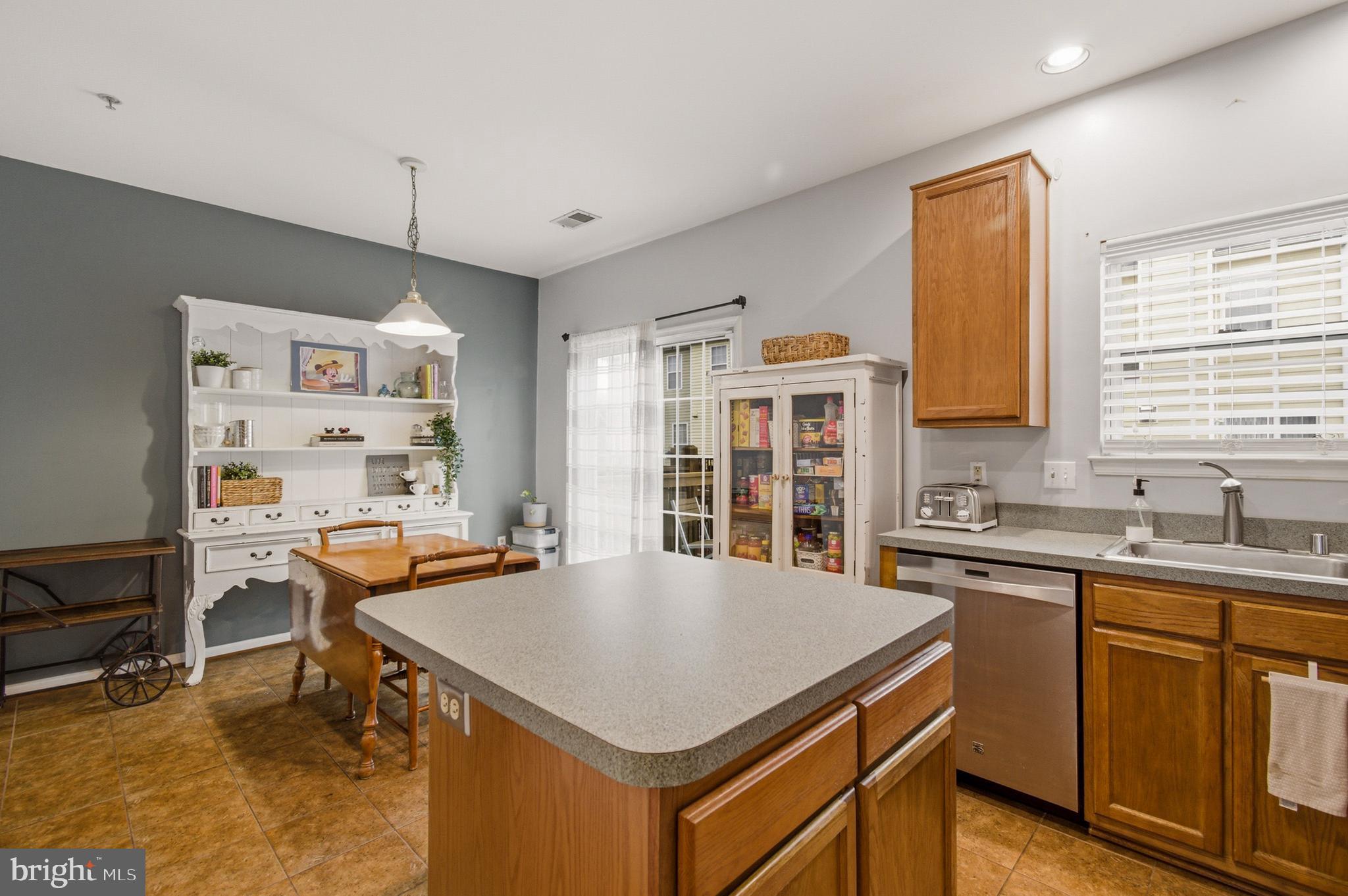 1212 Needham Court Crofton, MD 21114 - Photo 20 of 47 a kitchen with a stove a refrigerator and a sink