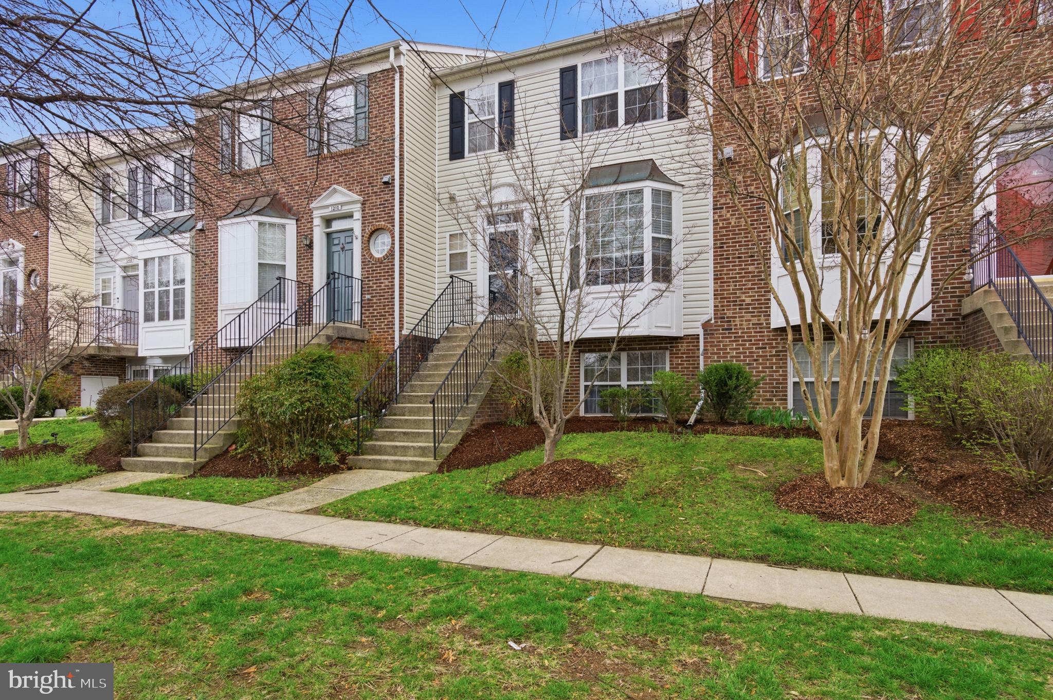 1212 Needham Court Crofton, MD 21114 - Photo 2 of 47 a front view of a house with a garden