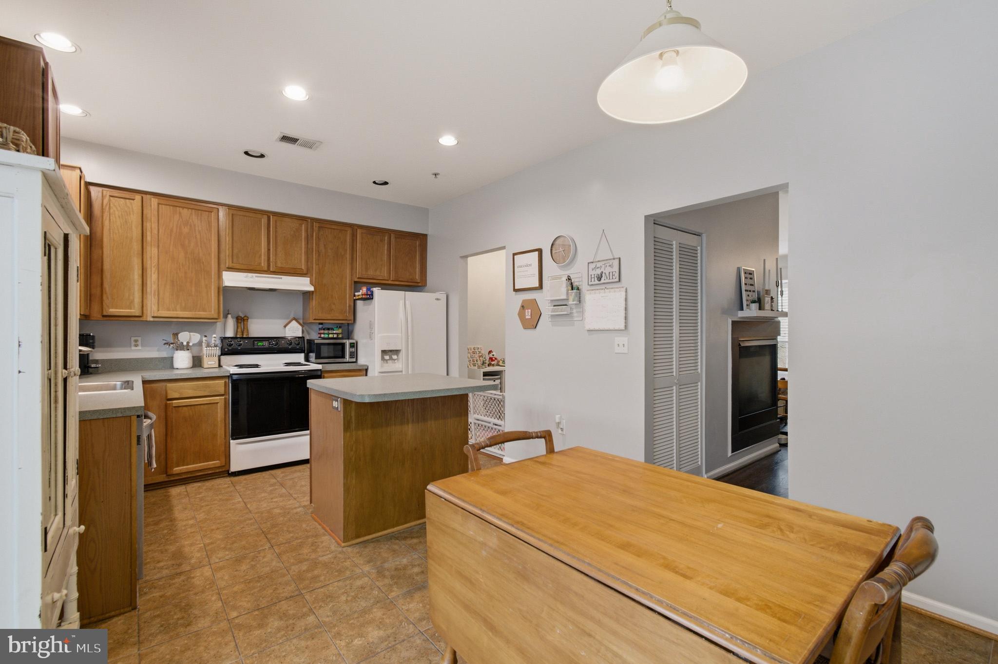 1212 Needham Court Crofton, MD 21114 - Photo 21 of 47 a kitchen with a refrigerator stove and sink