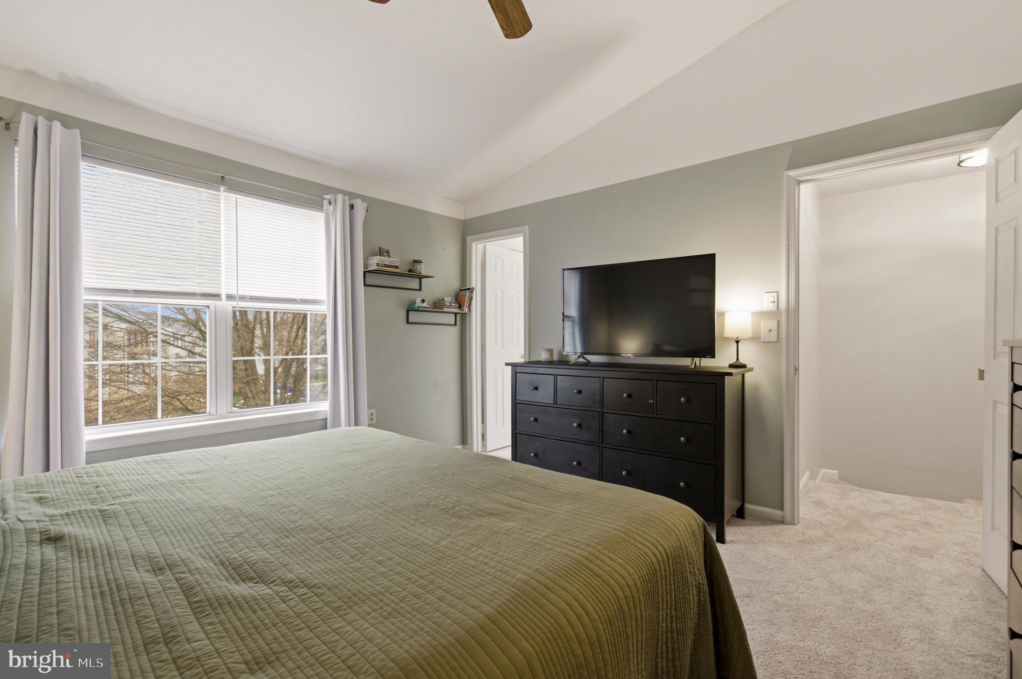 1212 Needham Court Crofton, MD 21114 - Photo 33 of 47 a bedroom with a bed and a television in it