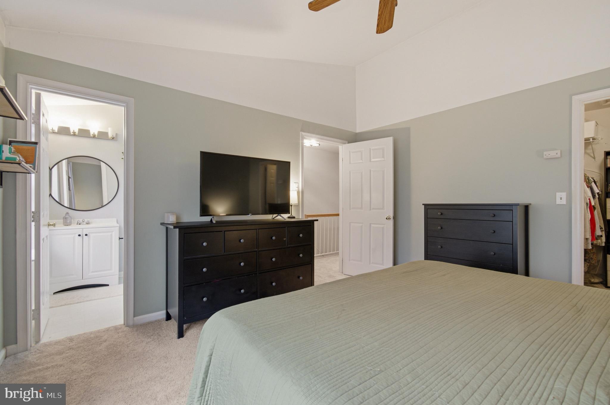 1212 Needham Court Crofton, MD 21114 - Photo 34 of 47 a bedroom with a bed and a flat screen tv