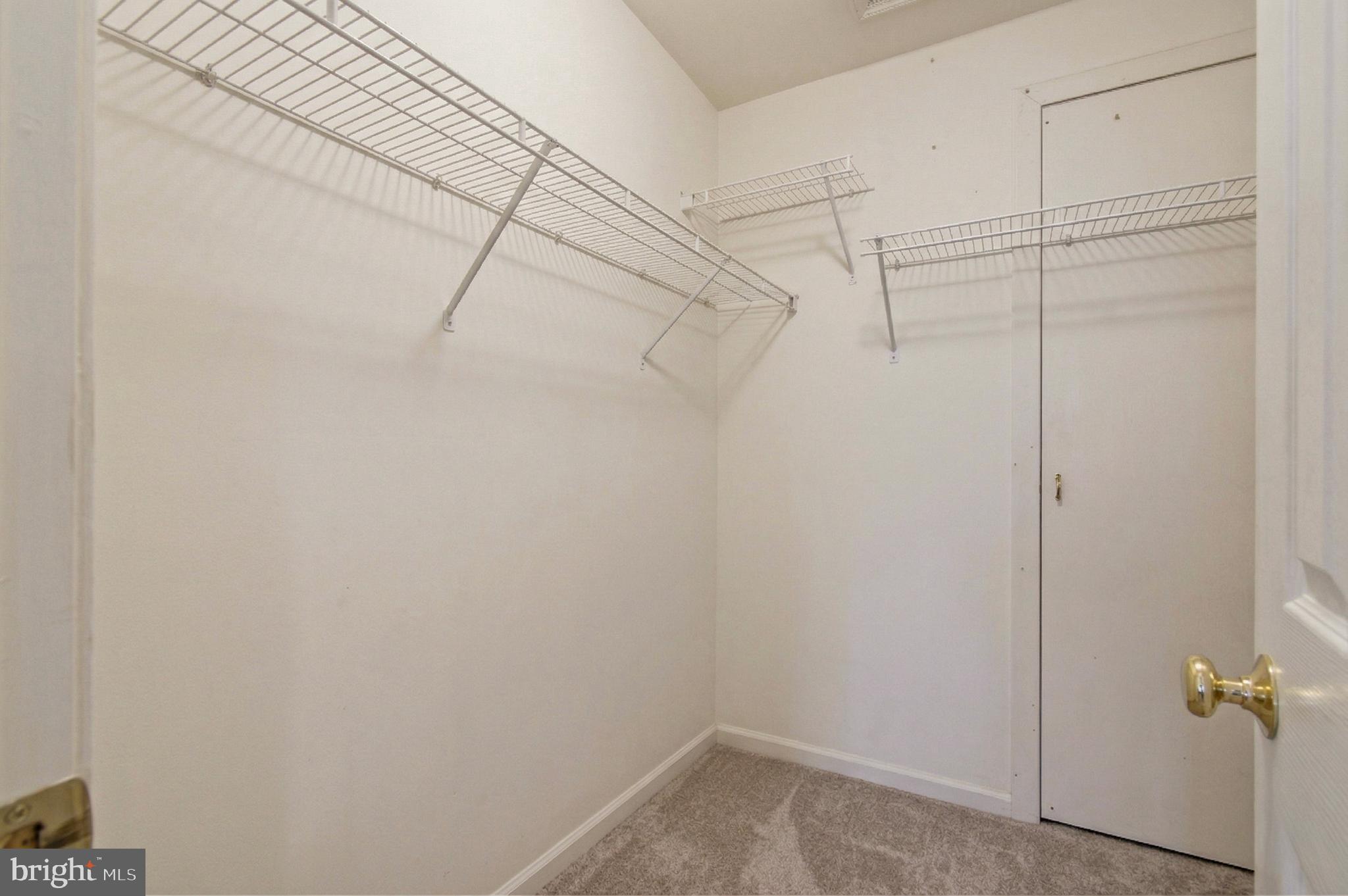 1212 Needham Court Crofton, MD 21114 - Photo 37 of 47 a view of a room with racks on the wall