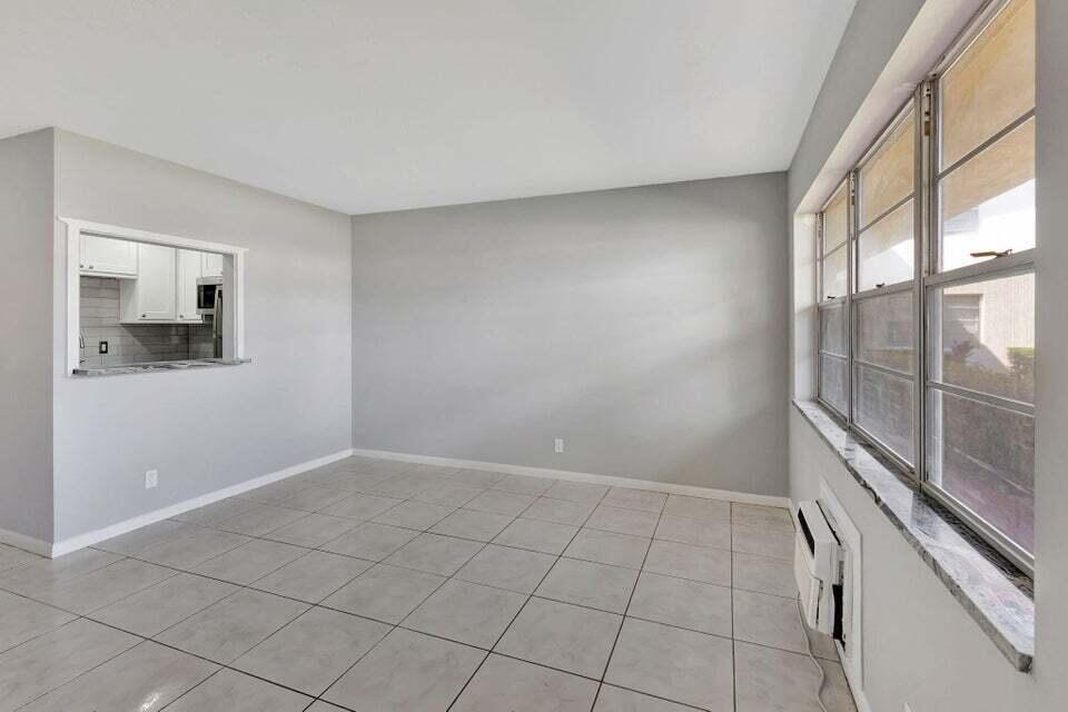 27 Camden B West Palm Beach, FL 33417 - Photo 13 of 34 a view of an empty room with a window