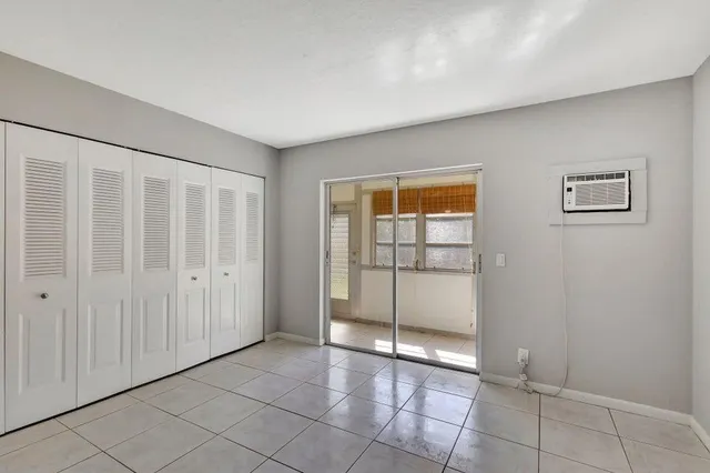 a view of entryway with a large window and wooden floor