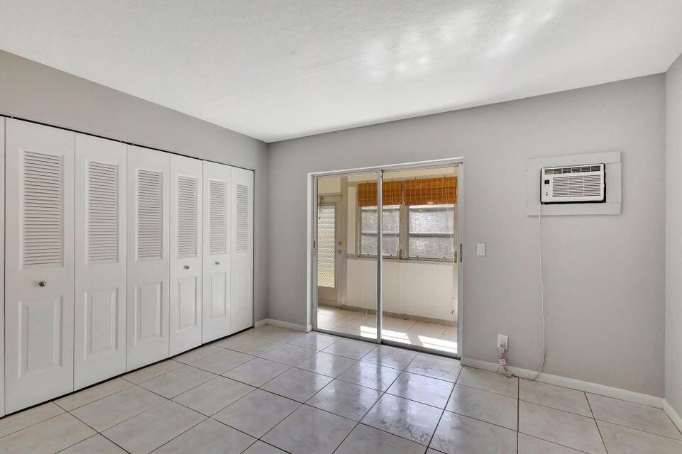 27 Camden B West Palm Beach, FL 33417 - Photo 19 of 34 a view of an empty room with window and closet area