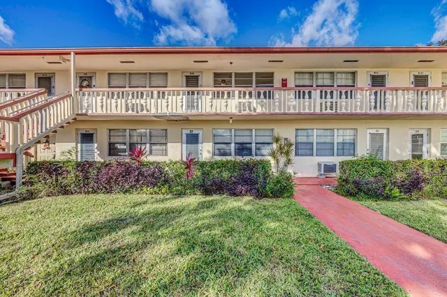 front view of a building with a yard