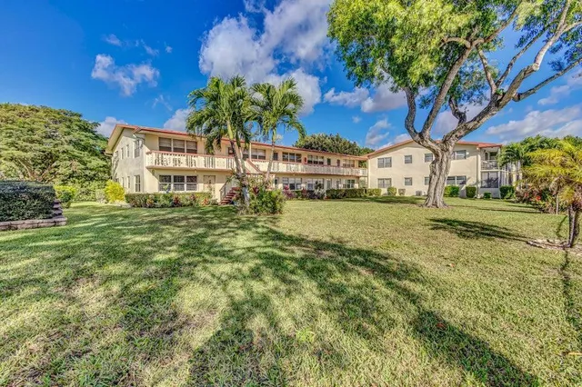 a view of a building with a big yard