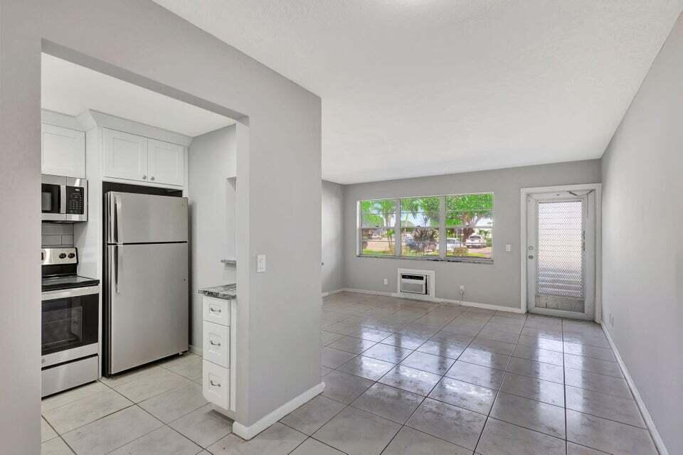 27 Camden B West Palm Beach, FL 33417 - Photo 7 of 34 a view of a kitchen with refrigerator and dishwasher